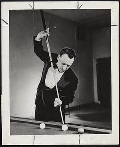Jake Schaefer Jr. exhibits the most delicate touch in billiard history as he preps for match with Willie Hoppe at the City Club in Boston on March 25, 26, and 27. The two experts will play a 300 point three cushion match.