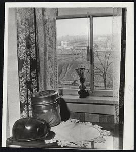 An Unchanging View -- This scene typical of idleness in the soft coal industry remained unchanged as miners continued to ignore pleas of John L. Lewis for a return to work in compliance with a court order. Tipple seen through window of miner's home is in Library, Pa.