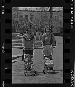 Women pushing strollers