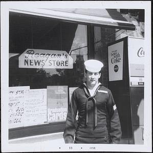 Robert Reagan in front of Reagan's News Store