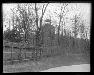 Unidentified building seen through trees