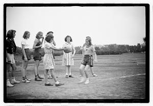 Girls playing a game, possibly kickball