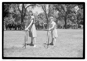 Girls rolling hoops