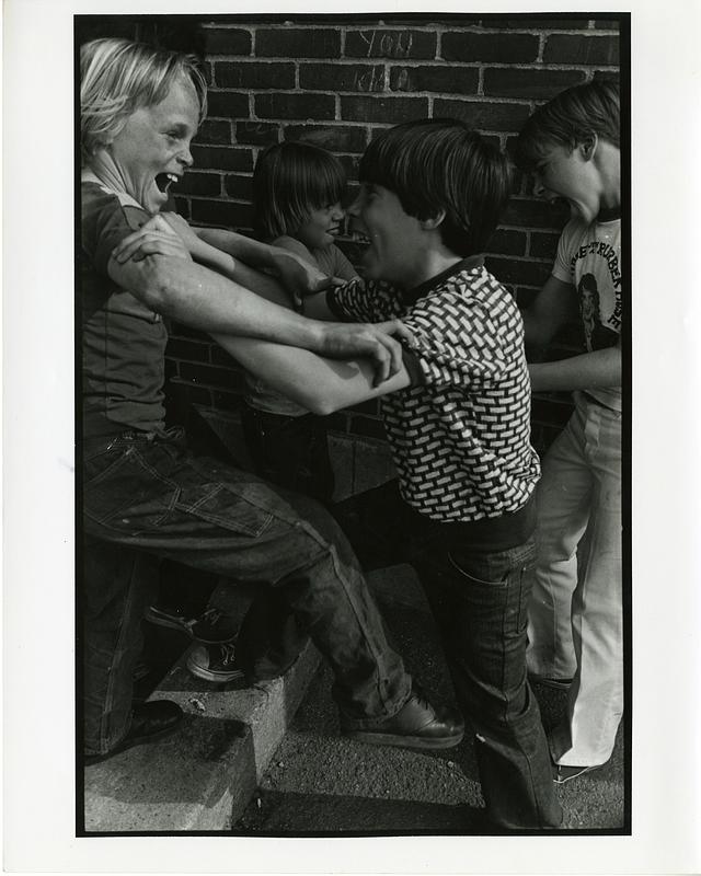 Four boys clowning around