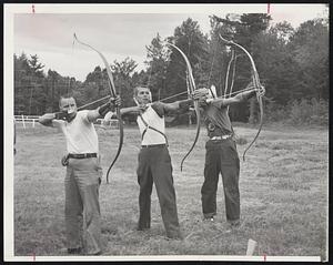 Taking Bows With Bows in Field Archery tournament at Mt. Sunapee State Park in Newbury, N.H., are third-time singles champion Reuben Powell (right) of Chula Vista, Calif.; runner-up Robert Rhode (left) of Minneapolis, and Irwin Ketzler of Flint, Mich., who won the men’s expert bowman, Class A, instinctive class.