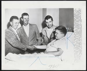 Chicago – His Heroes Are Rooting For Him – Johnny Gerber, 8, a staunch Chicago Cubs fan, is thrilled as his favorite Cubs players visit him in Augustana Hospital where he is awaiting surgery for removal of a brain tumor. His heroes are (left to right): pitchers Hal Jeffcoat and Don Kaiser and third baseman Ransom Jackson. “Wait, I'll tell the kids back home,” said Johnny, who lives in Carpentersville, Ill., northwest of Chicago.