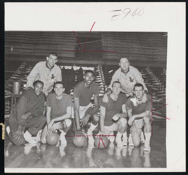 Guess Which One is Wilt (the Stilt) Chamberlain? That's right, he's third from the left. This is the Kansas starting team, named No. 1 in the country in this week's AP poll. Left to right, they are Maurice King, Gene Elstun, Chamberlain, Lew Johnson and John Parker. In back are assistant coach Jerry Waugh (left) and Coach Dick Harp.