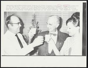 Fredi Everman, 58, (C) the longest living heart transplant recipient in the USA drinks a toast with his daughter-in-law Marie (R) and Dr. Robert Leachman (L) at a St. Luke's Hospital Christmas party 12/20. The retired Arlington, Va. barber plans to return home for the Christmas holidays. He received his new heart 7/20/68.