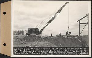 Contract No. 80, High Level Distribution Reservoir, Weston, looking southwest from a point 20 feet+/- east of Sta. 19+80 dam 1, showing unloading stone work and preparing to back off belt stones, high level distribution reservoir, Weston, Mass., May 29, 1940