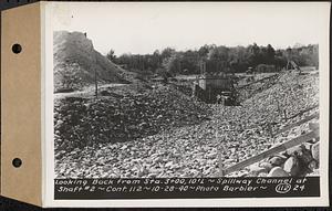 Contract No. 112, Spillway at Shaft 2 of Quabbin Aqueduct, Holden, looking back from Sta. 3+00, 10 feet left, spillway channel at Shaft 2, Holden, Mass., Oct. 28, 1940