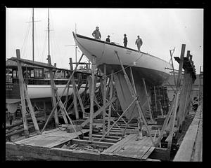 People on top of "Whirlwind" in dry dock