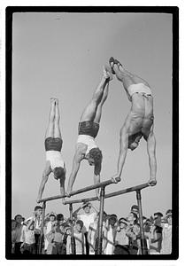 Gymnasts on parallel bars