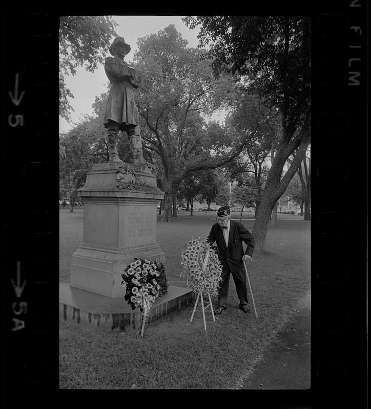 Elderly veteran puts flowers at Civil War general's statue, Boston Public Garden