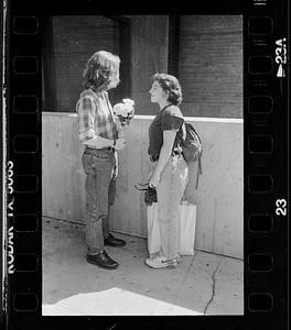 Couple meets with flowers, Boston