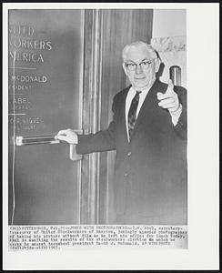 Jokes With Photographers--I.W. Abel, secretary-treasurer of United Steelworkers of America, jokingly accuses photographer of taking his picture without film as he left his office for lunch today. Abel is awaiting the results of the steelworkers election in which he seeks to unseat incumbent president David J. McDonald.