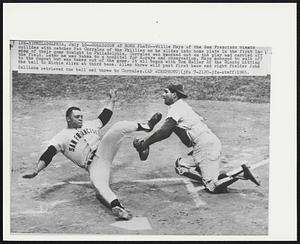 Collision at Home Plate--Willie Mays of the San Francisco Giants collides with catcher Pat Corrales of the Phillies as he slides into home plate in the first inning of their game tonight in Philadelphia. Corrales was knocked out on the play and carried off the field. Later he was taken to a hospital for X-rays and observation. Mays managed to walk off to the dugout but was taken out of the game. It all began with Tom Haller of the Giants hitting the ball to Richie Allen at third base. Allen threw wild past first base and right fielder John Callison retrieved the ball and threw to Corrales.