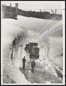 Clear Mountain Passes of Snow Mountain passes that have been closed since early last fall are now being opened with dynamite and giant snow plows. In the above scene highway crews are shown battling a 40-foot drift on the McKenzie Pass, high in the Cascade Mountains of Oregon.