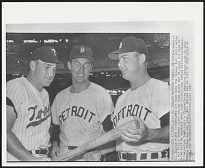 Kaline Rejoins Tigers -- Al Kaline (center) [Detroit] Tigers right fielder, who got back into the lineup last night after out with a broken collar bone since May 26, looks bug eyed at being held by teammate Norm Cash (right), and Harmon Killebrew, Minnesota Twins, before last night's Tigers-Twins American League game in Twin. The Twins won the game, 8-1. Kaline had no hits in four trips at plate.
