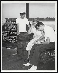 Tells Of Disaster To Boats. Daniel F. Sweeney, proprietor of a Salem Willows, Mass., boatyard (left) and his wife tells a reporter how he rented out 37 boats to Sunday fishermen before the violent storm broke today and caused at least four deaths and scores or persons to be missing as the 20-minute squall with gusts of hurricane force overturned 200 small boats. Sweeney was one of the men credited with recovering three bodies and rescuing several survivors.