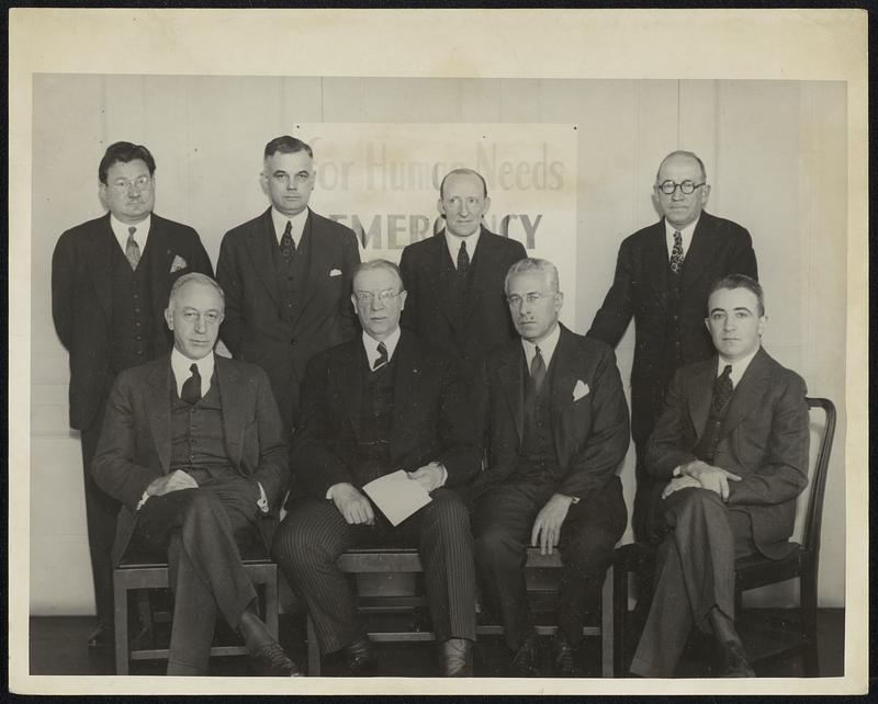 Mayor Mansfield, in his first appearance since his inauguration, at a luncheon, presides as chairman of the Boston Central Labor Union Emergency Campaign Committee at the Chamber of Commerce today. (Monday) Left to right: (Front row) J.W. Farley, general chairman of the Emergency Campaign of 1934; Mayor Mansfield, chairman of the Boston Central Labor Union Emergency Campaign Committee; Edward A.Taft, chairman of the Industry and Finance division; Francis A. Barrett, executive manager of the Emergency Campaign; (Back row) Harry N. Burroughs, exec chairman; William F. Dwyer, secretary-business agent of the Central Labor Union; Charles B. Campfield, president of the Central Labor Union; and James T. Moriarty, president of the Mass. branch, American Federation of Labor.