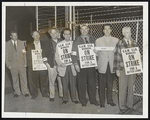 Somerville Ford Pickets-On strike at the Somerville Ford plant at 12:01 this morning were these members of Local 901, United Auto Workers, CIO. Leading the picket line is William A. Caton, right, of Somerville, president of the local.