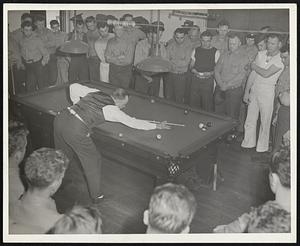 Erwin Rudolph, Five Times World champion Billiard Player, plays an exhibition match for the marines stationed at the Hingham Marine Ammunition Depot, at Hingham, Mass. under the auspices of the WPA War Mobile Recreation Unit. He is touring the country giving exhibitions for men in the armed service under the sponsorship of the Billiard Ass’n of America.