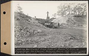 Contract No. 99, Enlargement of Fells High Level Distribution Reservoir, Stoneham, Malden, Melrose, looking northwest from floor of basin 2 showing excavation for channel between basins 1 and 2, enlargement of Fells Reservoir, Stoneham, Mass., Sep. 27, 1940