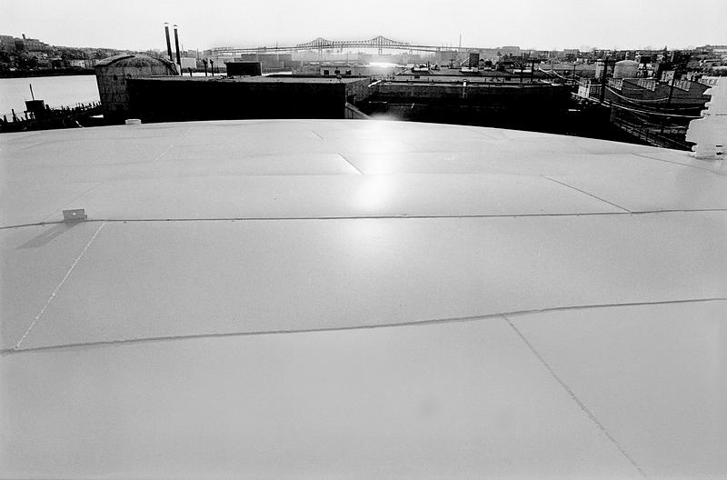 Rooftops and bridge in the distance