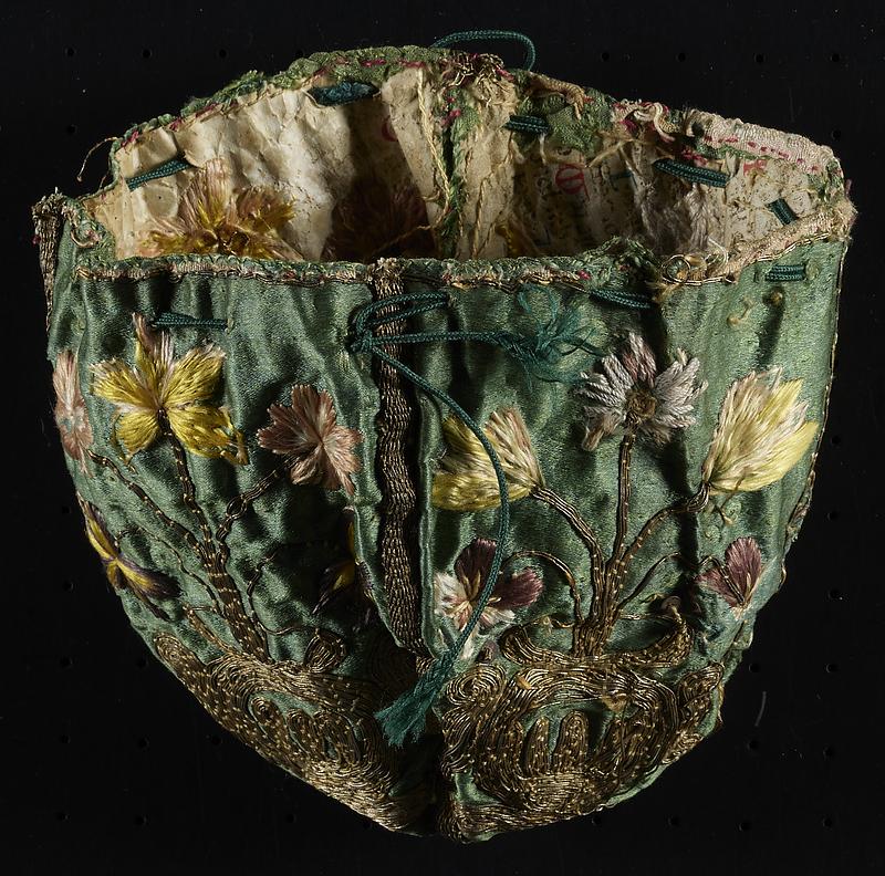 17th-century embroidered silk purse stabilized with fragments of medieval manuscript waste