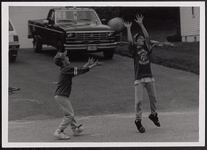 Boys playing basketball