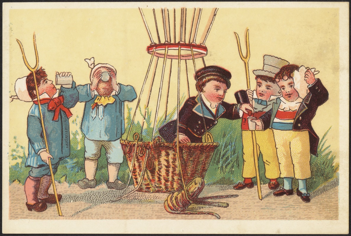 Five boys, four standing around a grounded hot air balloon, one standing inside the basket pouring drinks for the others.