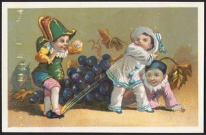 Three boys, one spraying another by squashing a grape.