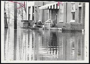Occupants of flooded homes refuse to be evacuated by CD workers at Harrisburg, Pa., after Susquehanna River rose to 22 feet.