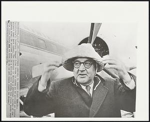 Governor Arrives to Survey Flood Damage-- California's Governor Edmund G. Pat Brown is shown as he arrived at Arcata airport near here today. The Governor is making a personal survey of the damage area. He arrived here in a driving rain storm. His first words were "The first thing we have to do is get these roads in shape."