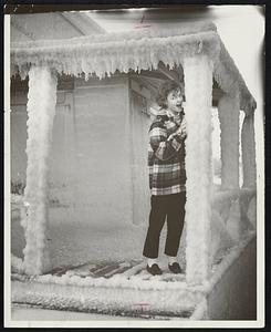 Good Enough to eat for Karen Finley is this icy post on frosted cottage on Hull shore. Karen, who lives in New York City, is visiting her aunt and uncle, Mr. and Mrs. Lyman S. Griffin of 83 Greene St., Wollaston.