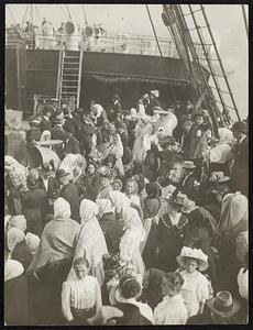 Immigrants awaiting to be landed, in the land of honey.