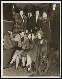 Phone Girls Leave for San Francisco Fair. A group of seven New York telephone girls boarded the "Commodore Vanderbilt" at Grand Central Terminal today bound for San Francisco on a novel mission. With seventeen other young women they have been trained by the New York Telephone Company to operate "Pedro the Voder", the first machine with which speech can actually be created. Left to right - front: Miss Grace E. Anderson, Mrs. Maybelle E. Duffy and Miss Eleanor T. Harnett. Rear row: Miss Dorothea F. Mahoney, Miss Anna Mae R. Swenson, Miss Dorothy T. Whalen and Miss Mary V. Muldoon.
