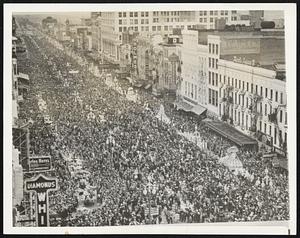 His Subjects Hail King Rex. Here is part of the crowd in Canal Street yesterday watching the Mardi Gras parade over which King Rex ruled supreme and which marked a high point in the carnival celebration here.