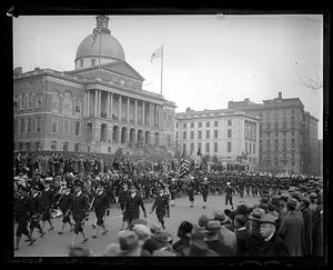 Parade of soldiers marching down Beacon St., Boston State House in background