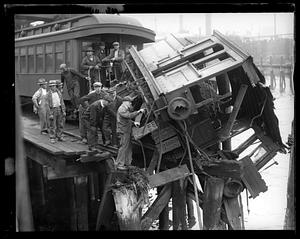 Narrow gauge railroad engine goes into Boston Harbor