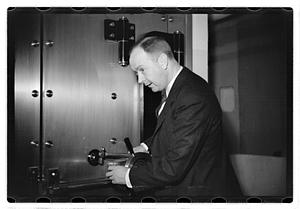 A man demonstrating how to break into a safe