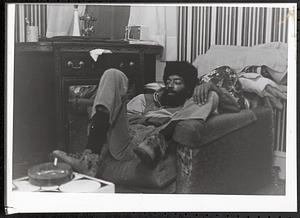 Man sitting on a sofa chair