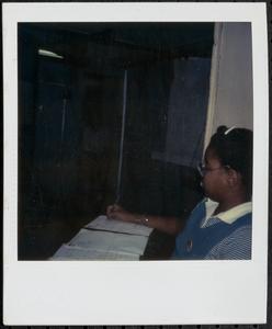 Girl sitting and writing