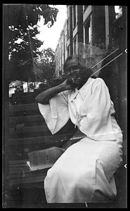 Lottie Miller sits on bench