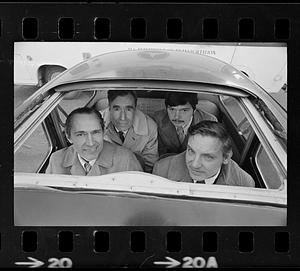 Four commuters in Volkswagen "bug," Boston
