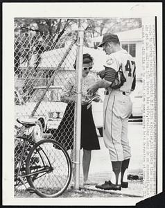 Jay Hook, N.Y. Mets pitcher who rides a bicycle to spring training workouts for extra exercise, had barely time to park and get into uniform 3/11 before his wife, trailing along in an automobile, had caught up with him so he could sign some papers he'd forgotten at home.