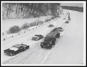 Cars on snowy highway