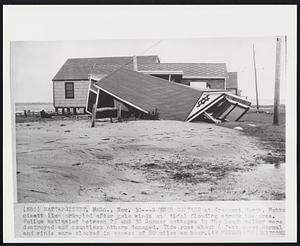 Mattapoisett, Mass. - Summer Cottage at Crescent Beach. Mattapoisett lies crumples after gale winds and tidal flooding struck the area. Police estimated between 25 and 30 Summer cottages in the beach colony were destroyed and countless others damaged. Tide rose about 6 feet above normal and winds were clocked in excess of 80 miles an hour.