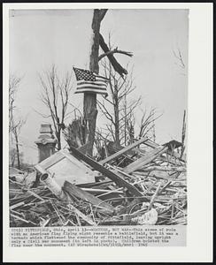 Pittsfield, Ohio – Weather, Not War – This scene of ruin with an American flag flying might resemble a battlefield, but it was a tornado which flattened the community of Pittsfield, leaving upright only a Civil War monument (to left in photo). Children hoisted the flag near the monument.