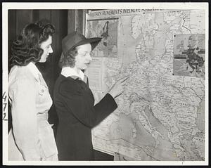 Following the Battle-Line - Sophie Goldberg and Bridie O'Connell, left to right, study one of the war maps on display in the vestibule of the Boston Public Library, Copley square.